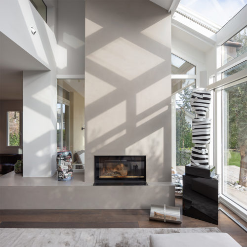 Réalisation d’une cheminée dans l’espace véranda d’une maison familiale à Genève.